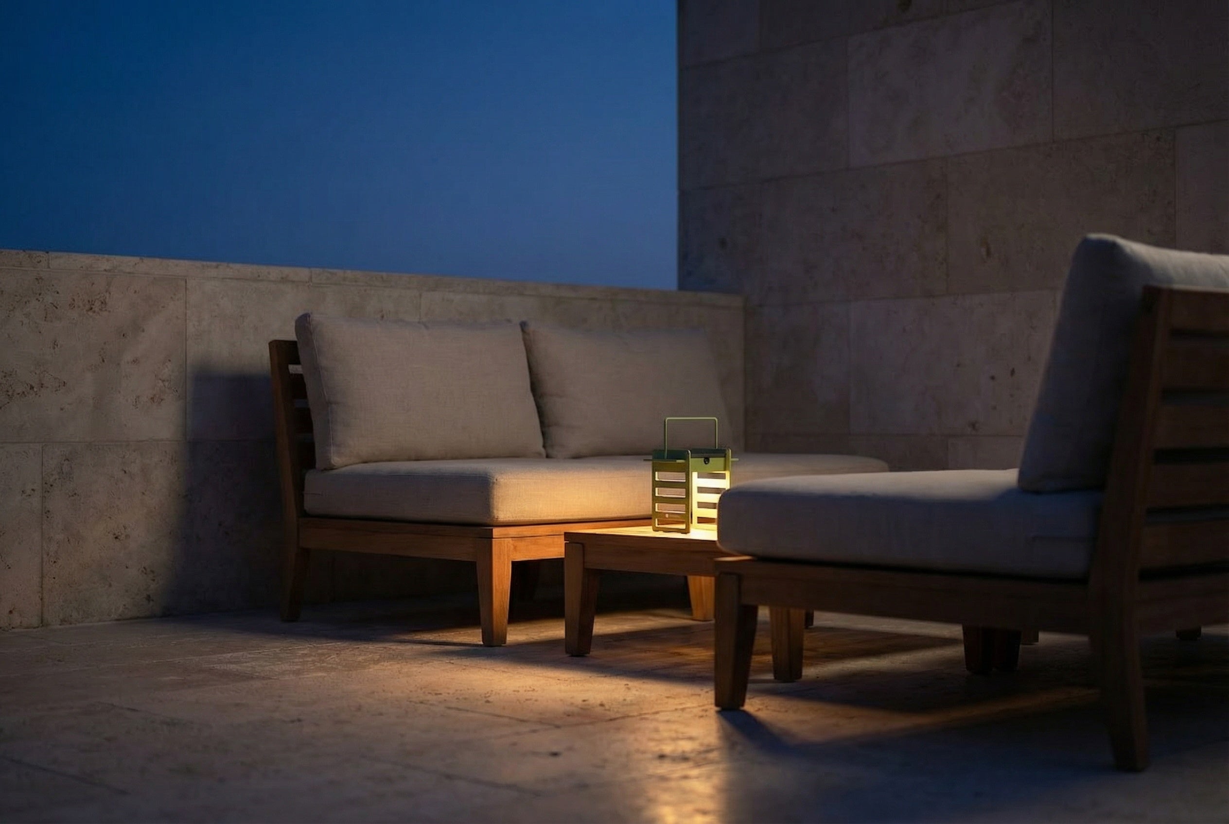 A Bianova solar lamp on the terrace emits a warm 2000K amber glow during Europe's "blue hour".